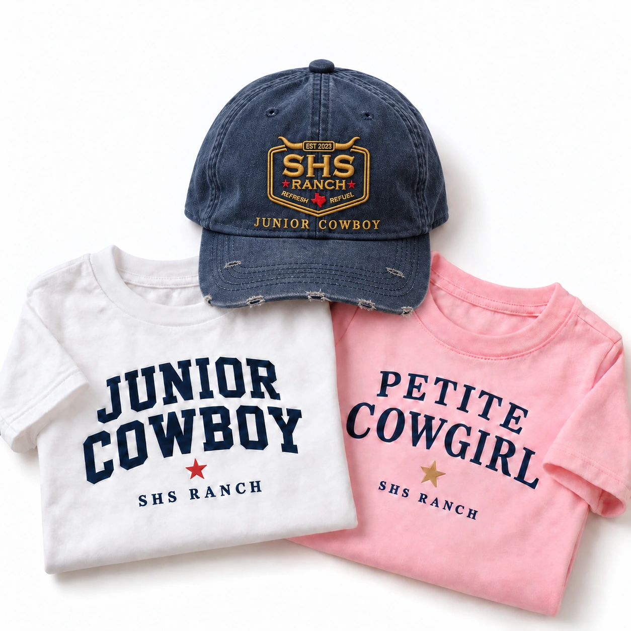 Children’s Junior Cowboy hat and white tee beside a pink Petite Cowgirl tee; merchandise concept